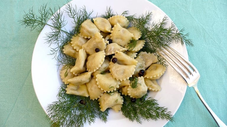 Mezzelune pasta filled with “porchetta” pork roast in fennel juniper butter